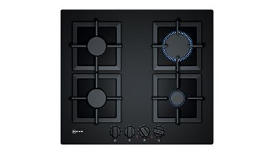 Black gas hob with one cooking zone switched on.
