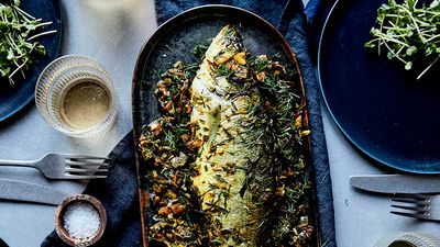 Baked sea bass, garnished with herbs and spices