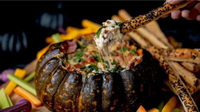 Baked pumpkin stuffed with cheese and bacon dip