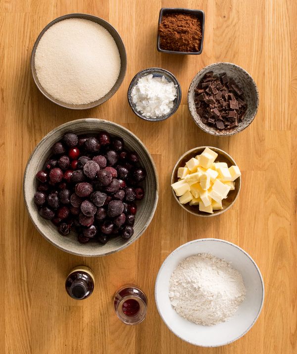 Numerous individual ingredients for witches crumble on counter top