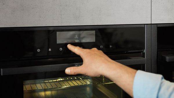 Person using TFT-display on NEFF Single Oven