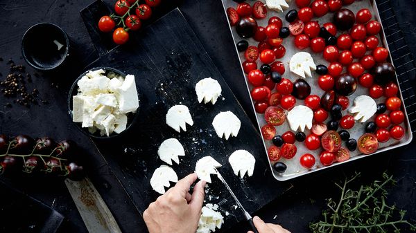 Cutting feta cheese into ghost shapes