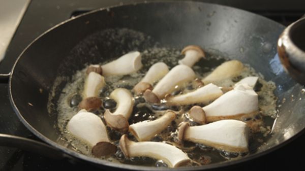 Mushrooms and butter in a pan