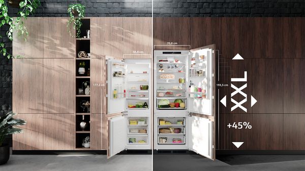 A free-standing fridge freezer with open doors, displaying multiple bottles and other contents