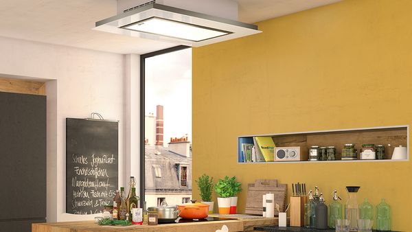 Ceiling hood shown in front of mustard yellow wall 