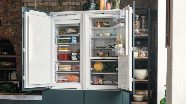 An open side-by-side unit with the freezer on the left