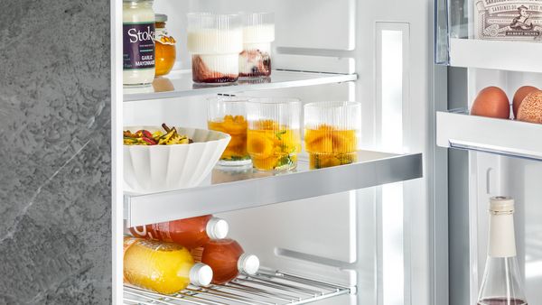A look into an open fridge, showing possible positions of the shelves