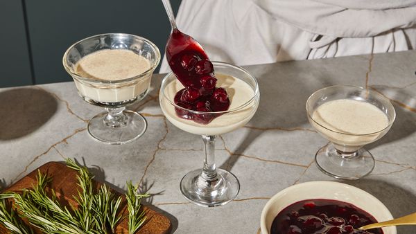 Decorating the Panna Cotta with the mulled wine cherry topping