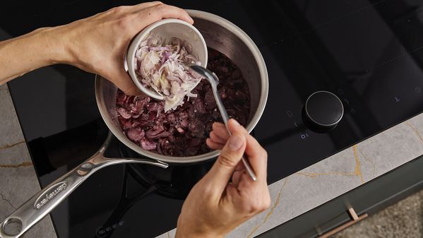 Cooking the red wine sauce