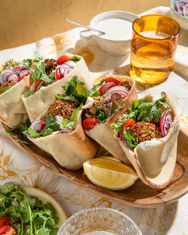 filled pita breads served on a table 