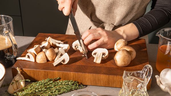 Cutting mushrooms into bite-sized pieces