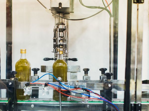 Olive oil being put in to bottles