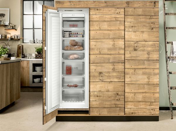 NEFF Freezer with door open in oak kitchen unit