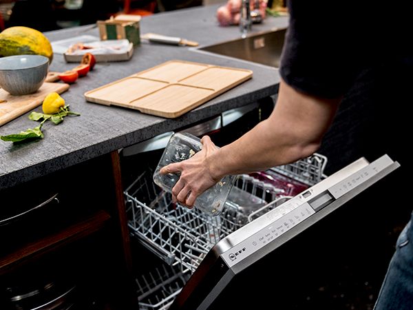 NEFF Gourmet Tray dishes being placed in dishwasher
