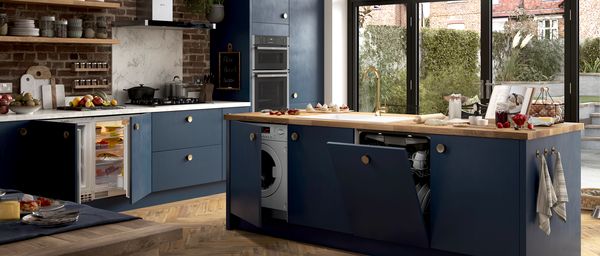 Brick and blue styled kitchen with NEFF N 50 built-in appliances doors open