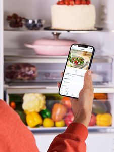 Image showing how to use the Samsung Smart Fridge with the Samsung Smart Fridge app for efficient kitchen management.  