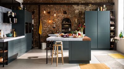A kitchen with a brick wall and high-tech materials combined