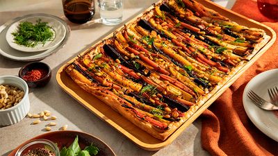 A mixed and coloured carrot tart with ricotta and pine nuts