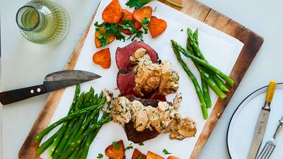 Sliced chateaubriand with mushroom sauce, heart-shaped potatoes and asparagus