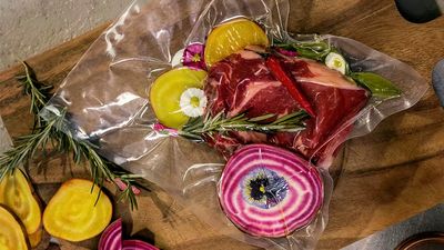 Vacuum packed entrecote with striped beetroot, rosemary and edible flowers