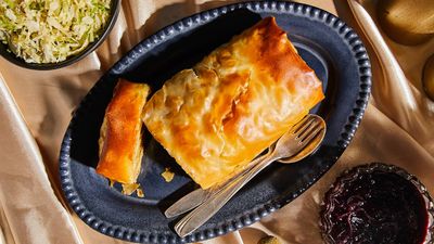 Savoury potato and hazelnut strudel with braised  cabbage and red wine sauce