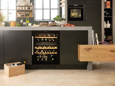 A wine cooler integrated underneath a kitchen island