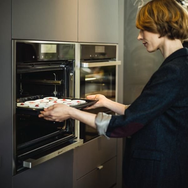 Person using Slide&Hide oven