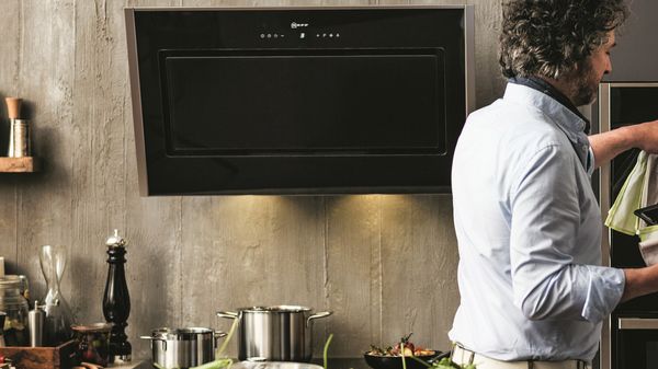 NEEF Kitchen Hoods with a man in a kitchen