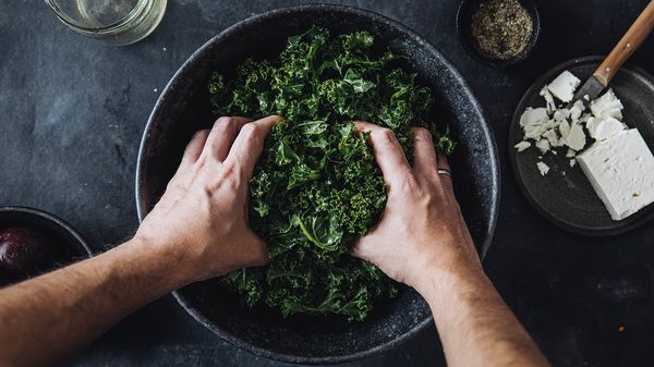 washed kale and the dressing in a bowl 