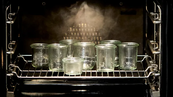 Jars heating in oven.