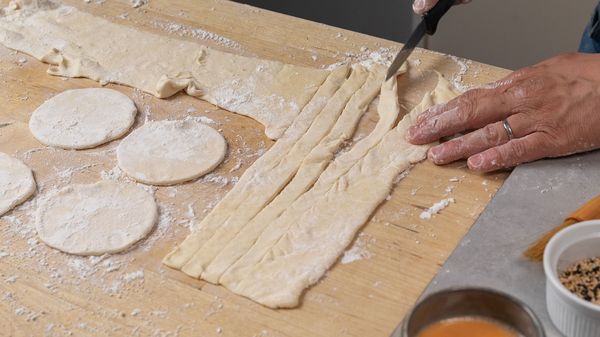 Person cutting puff pastry