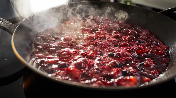 Cooking berries in a pan