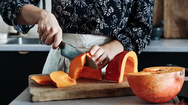 Cutting pumpkin into chunks