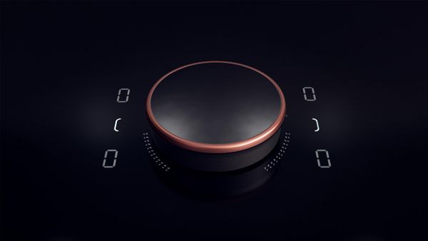 En närbild på Twist Pad® på hällen, som visar fyra nollor digitalt i de fyra hörnen kring den runda knappen.