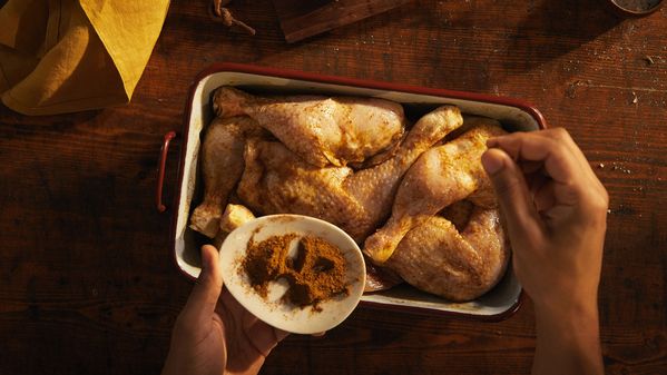 Marinating and baking chicken thighs in Cajun seasoning