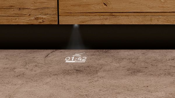 Светлина, проектираща символ от долната страна на съдомиялната машина върху пода