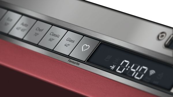 Close-up of the dishwasher control panel with a focus on the favourite button on the left of the display