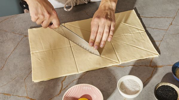 Cutting the puff pastry sheets lengthwise