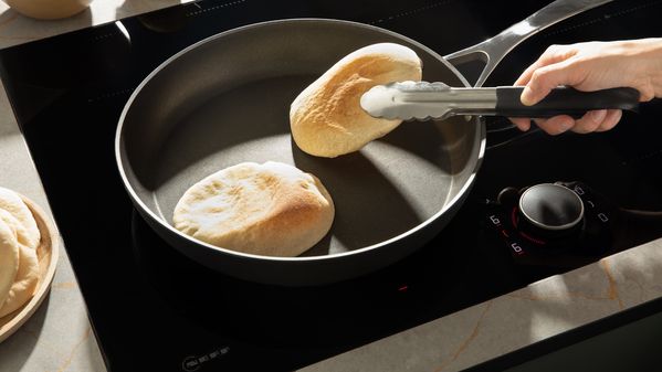 Toasting the pita in a pan