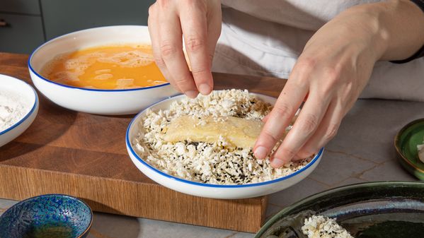 Dipping the fish into the panko sesame mix