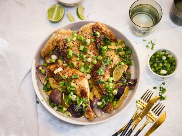 Tender chicken served in a bowl with ginger and spring onions.