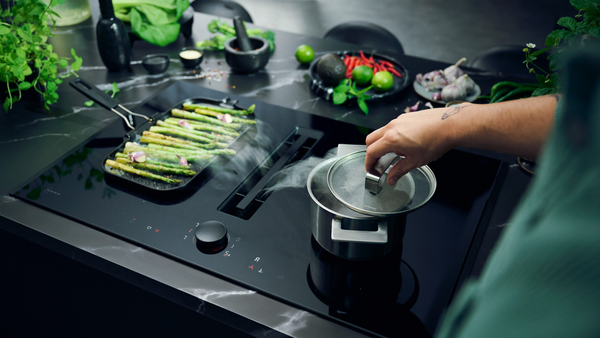 Aerial view of cooktop with a pot of colourful vegetables  