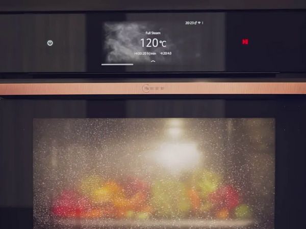 Close-up of N90 Metallic Silver oven showing Intensive Steam behind the steamed up oven door