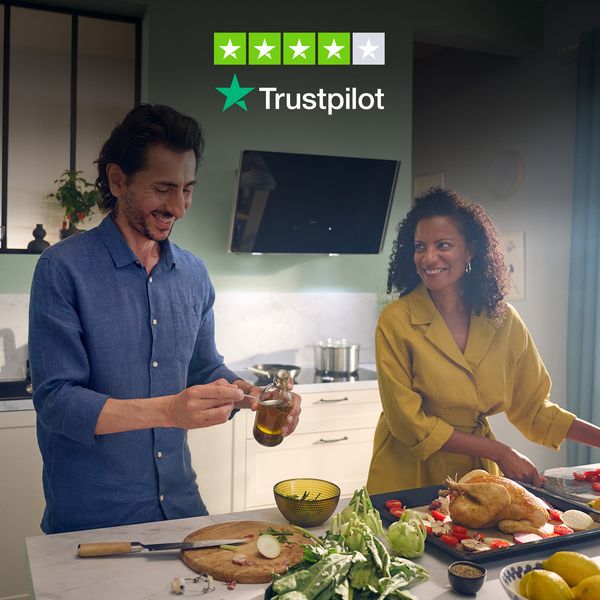 People cooking in kitchen with Trustpilot logo overlay