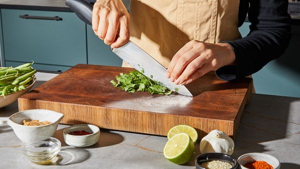 Chopping cilantro on a cutting board