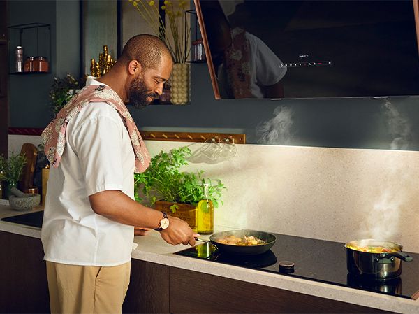 Man using NEFF Slide&Hide oven