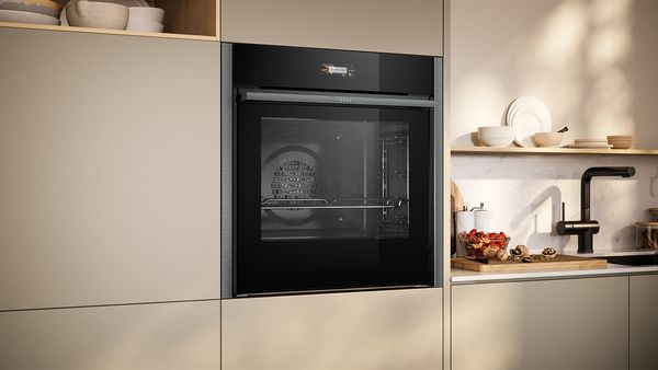 Neff Slide & Hide® Oven B54CR71G0B in kitchen interior