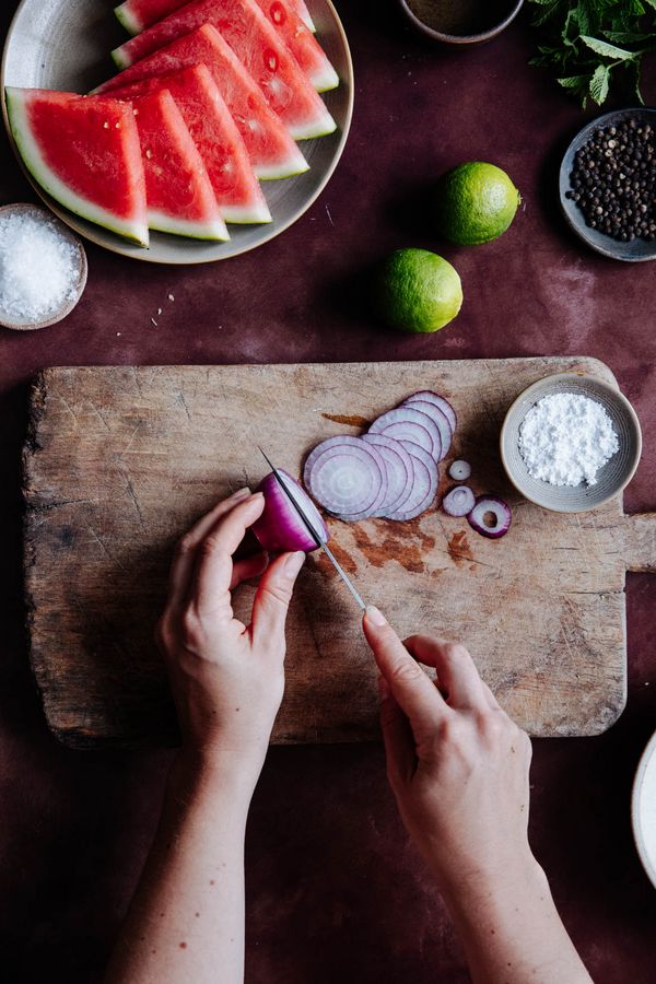 Red onion chopped on wooden chopping board