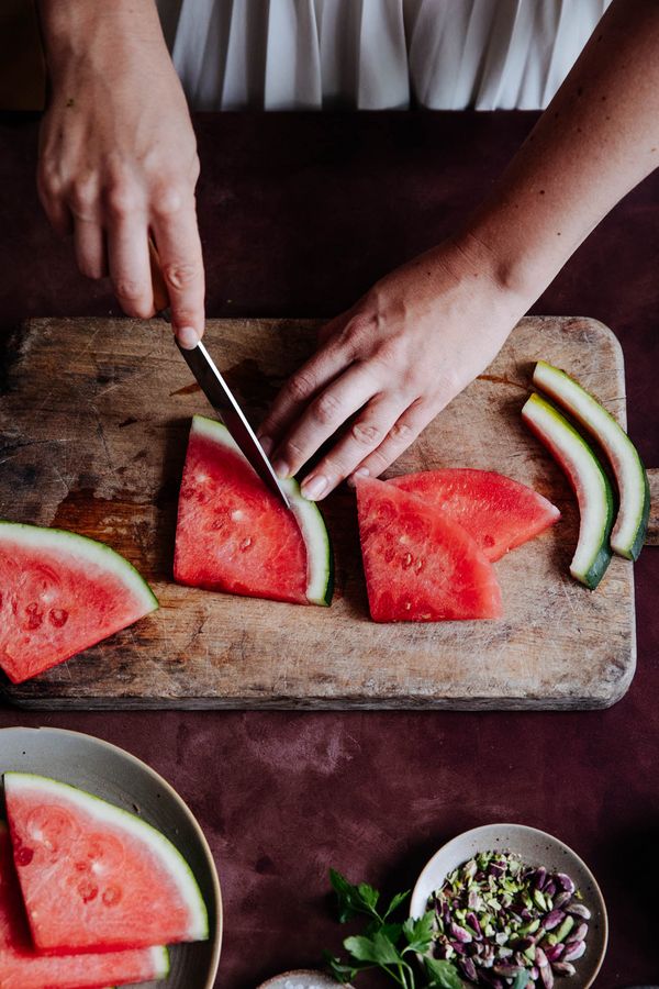 Melon chopped on rustic wooden board. 