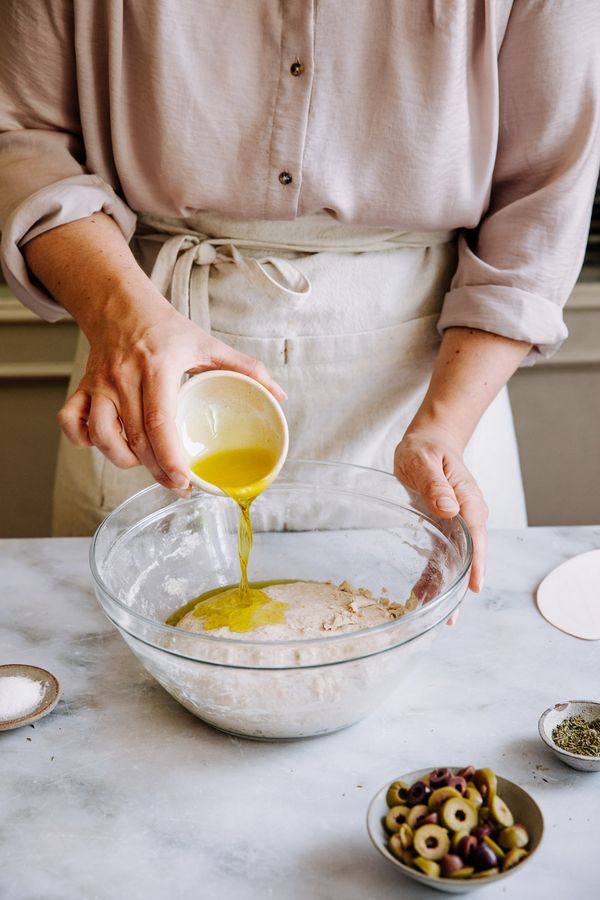 Oil poured over the dough in the mixing bowl. 